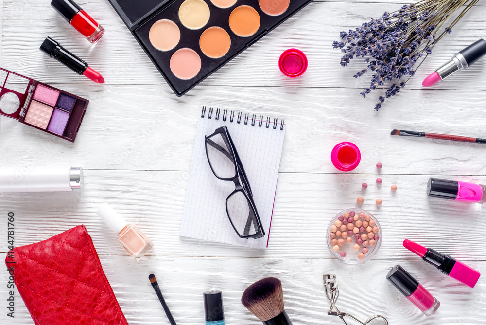 set of cosmetics for women with lavender office background top view