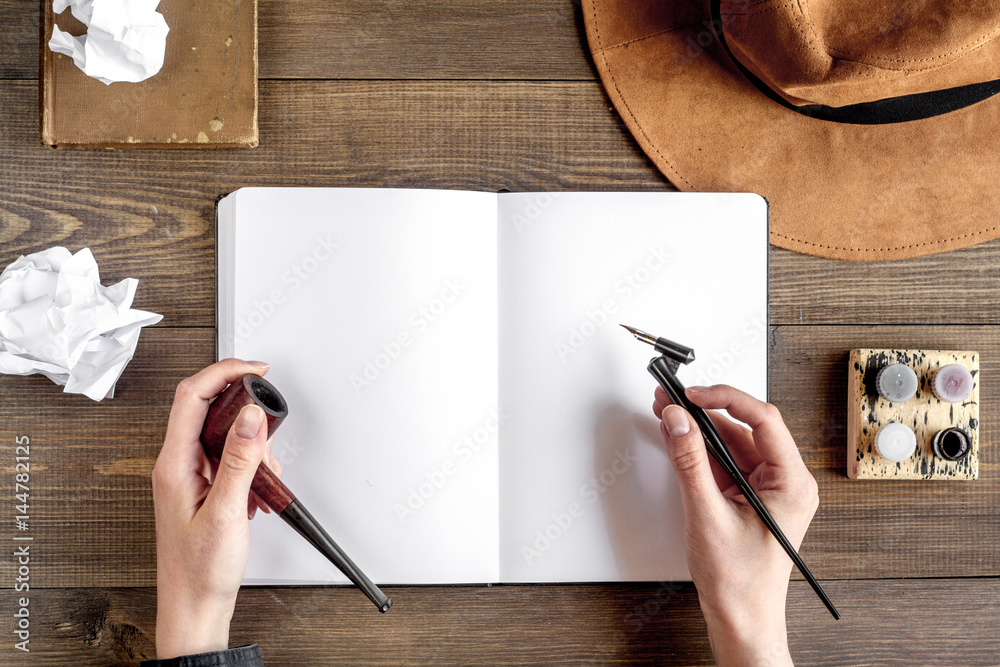 writier tools in profession concept on wooden background top view