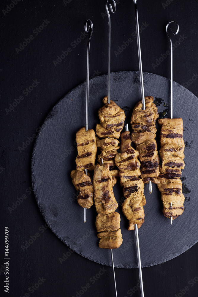 Pork satay served with peanut sauce or sweet and sour sauce. 