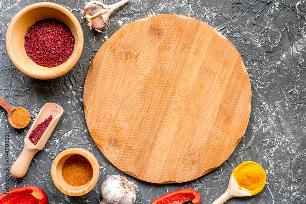 composition of cooking tools and spices on kitchen table top view