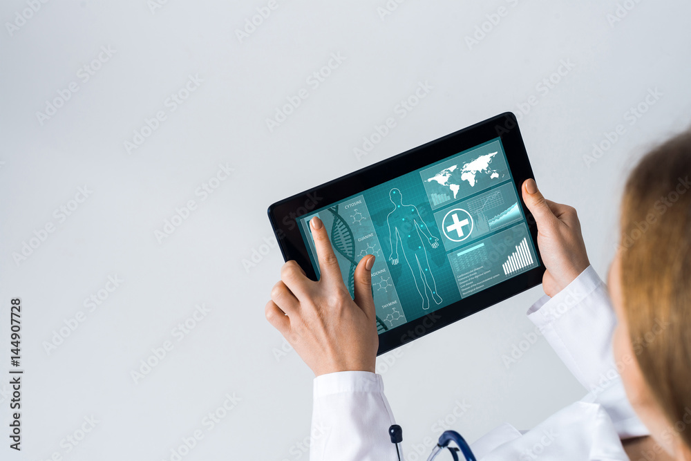 Close of female doctor hands working with tablet pc computer