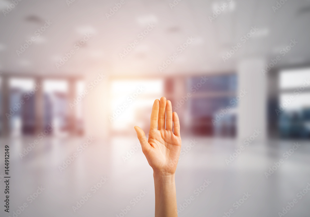 Choosing gesture of person in elegant modern interior in sunshine light