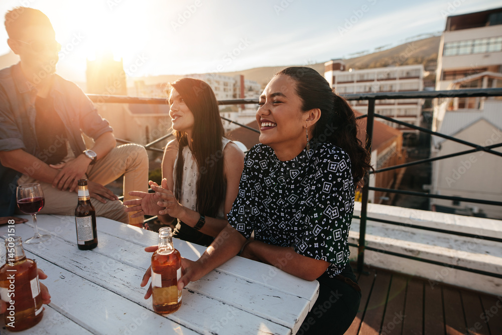 Smiling woman having a party with friends