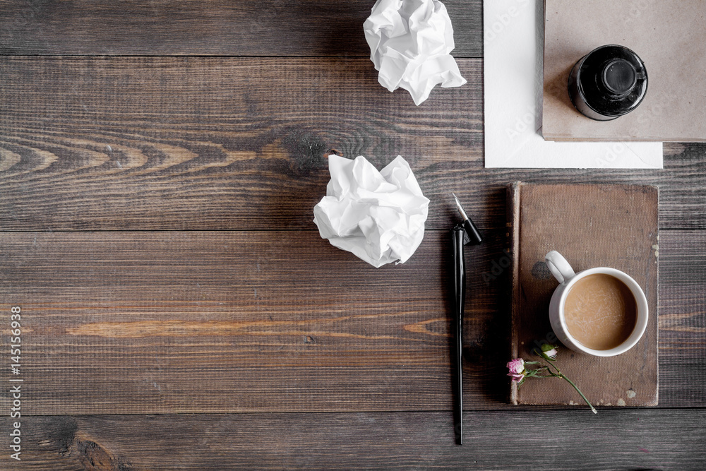 Writer workplace with tools on wooden background top view mock up