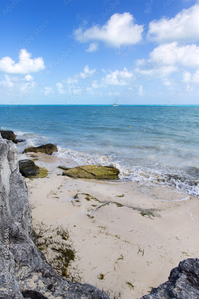 Sea shore. The coastline of the Caribbean sea. Cloudy sky on a partly sunny day.