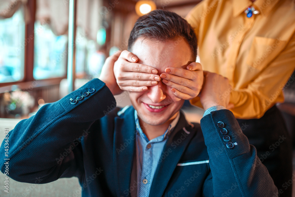 Female person closes eyes hands to man