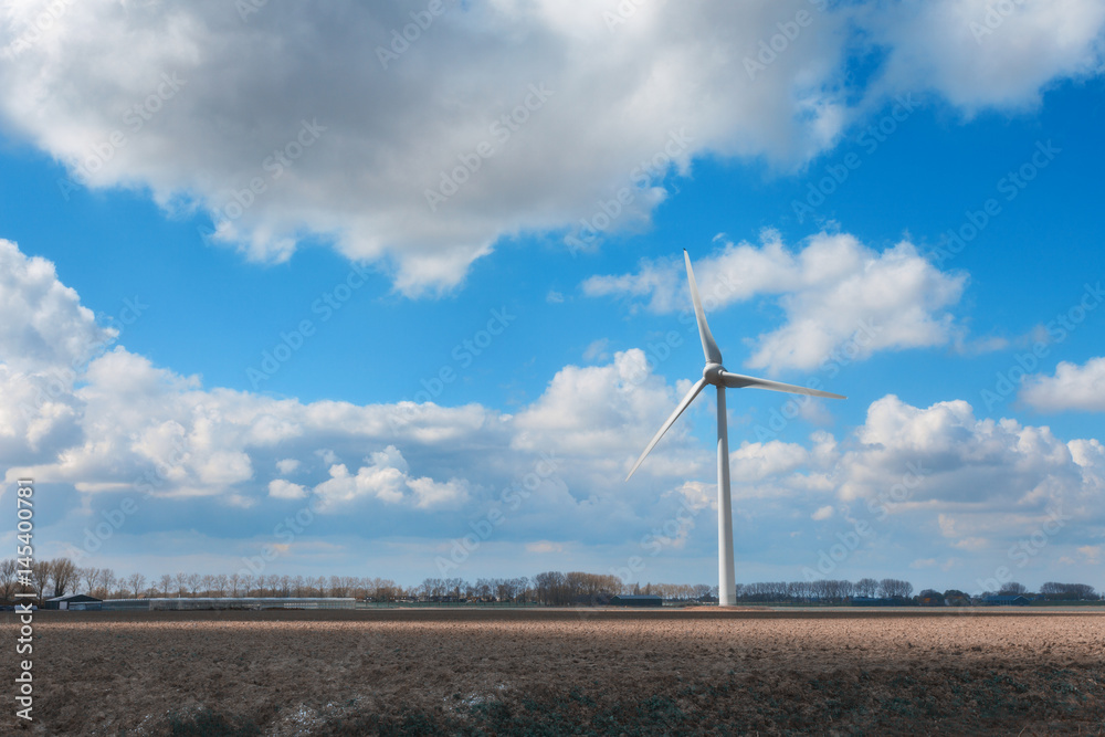 Wind turbines generating electricity. Windmills for electric power production. Landscape with wind m