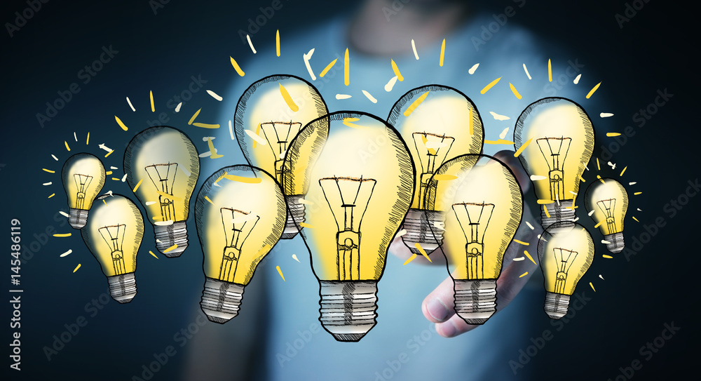 Businessman touching hand-drawn lightbulb with his finger