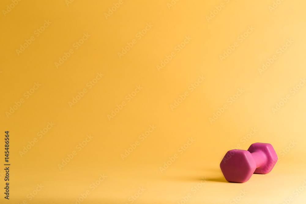 A single pink dumbbell