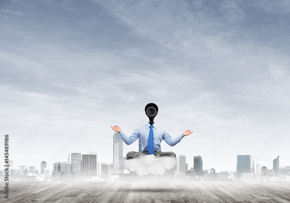 Camera headed man sitting in lotus pose on cloud against modern cityscape