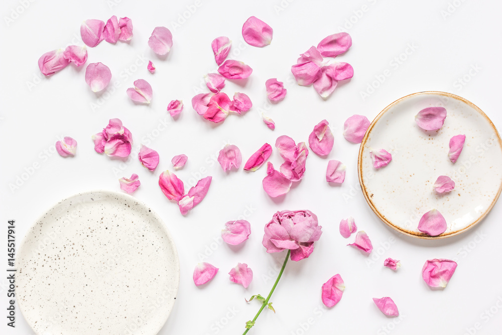 spring floral design with rose petals in soft light top view mock-up