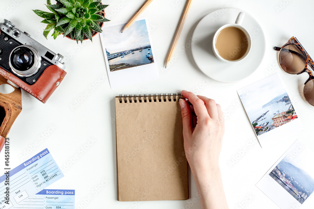 journey planning with tourist outfit on white table background top view