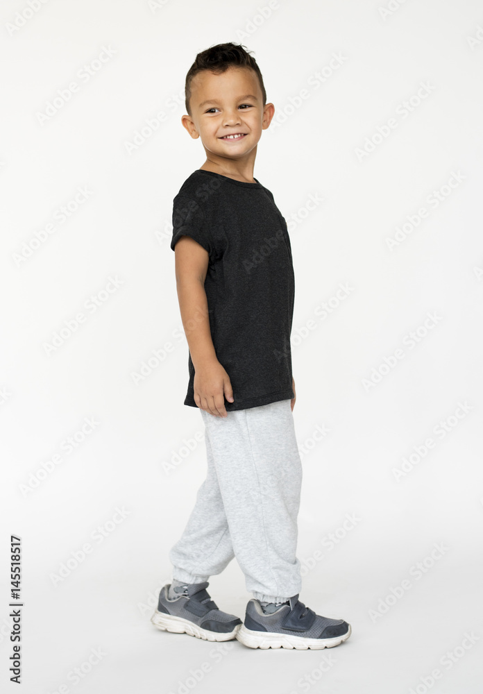 Happiness little boy smiling casual studio portrait