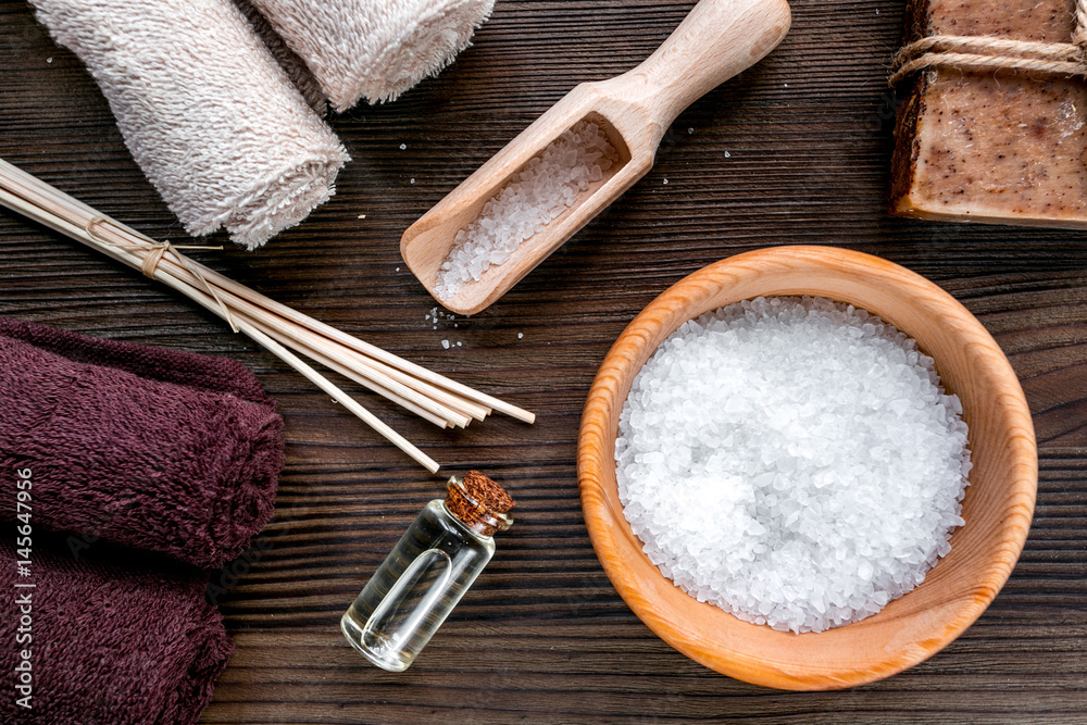 spa composition for body care with salt on wooden background top view