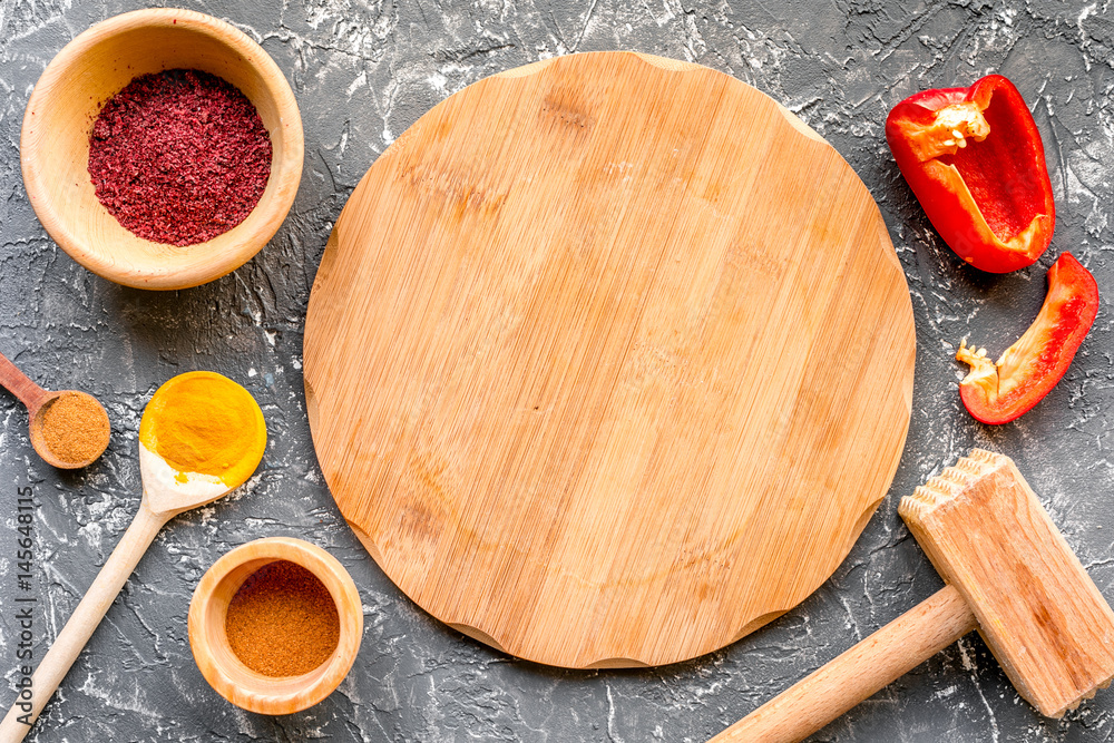 Cook workplace with kitchen tools and sweet pepper gray background top view