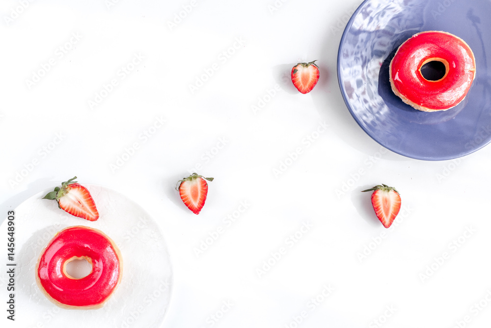 lunch with donuts and strawberry on white background top view mock up