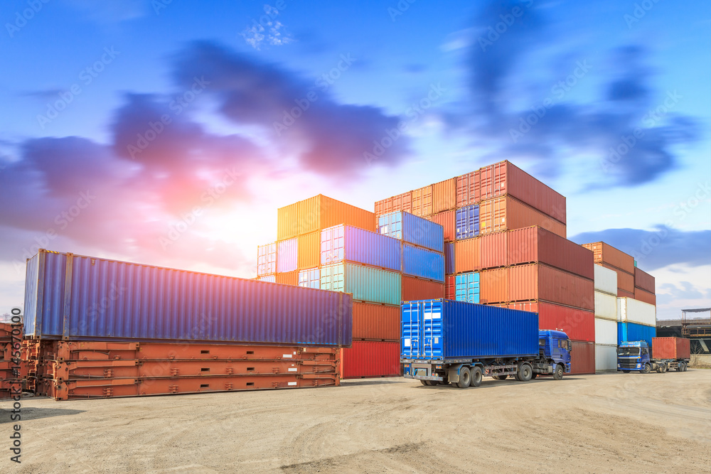 Industrial port container terminal at sunset