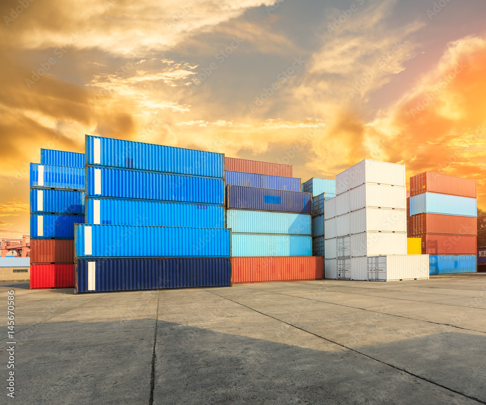 Industrial port container terminal at sunset