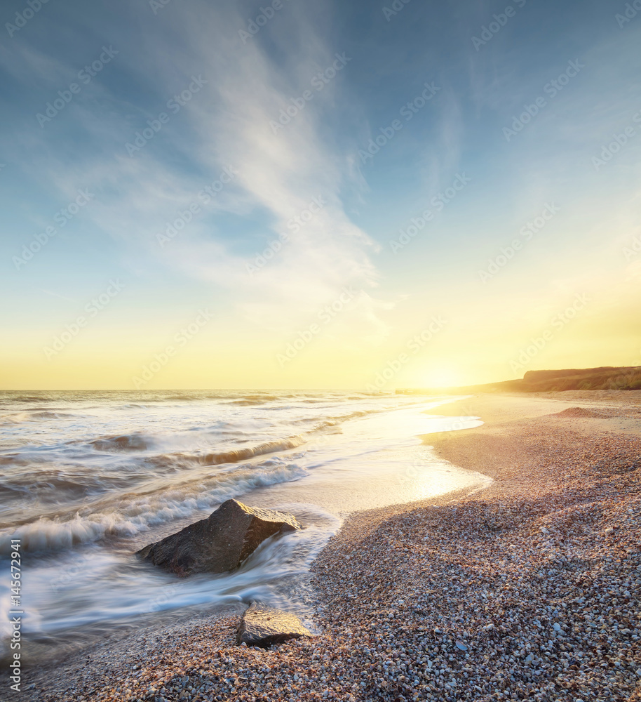 Sea shore during sunrise. Beautiful natural seascape