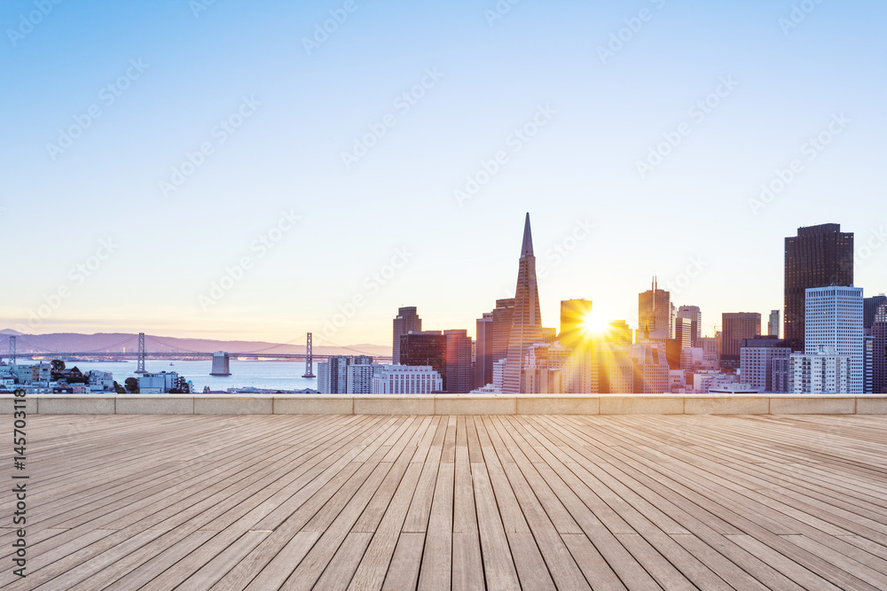 empty wooden floor with cityscape of modern city