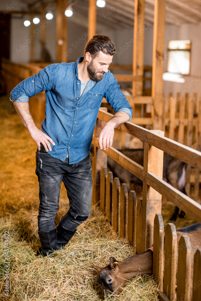 Farmer at the goat barn