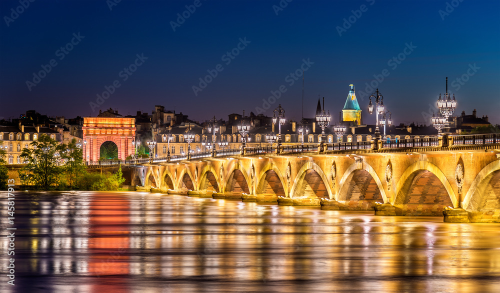 Pont de Pierre bridge and Porte de Bourgogne Gate in Bordeaux, France