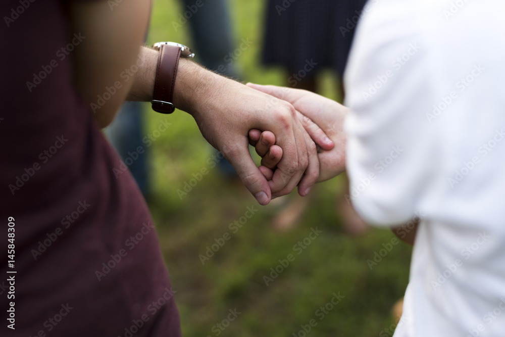 Group of people support unity arm around together