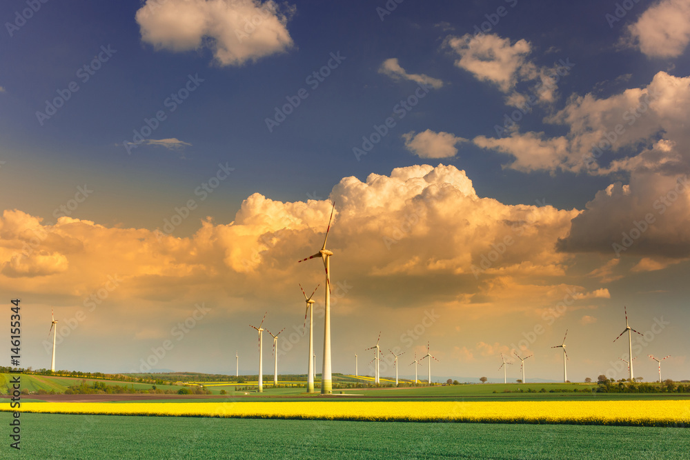 Wind farm with spinning wind turbines