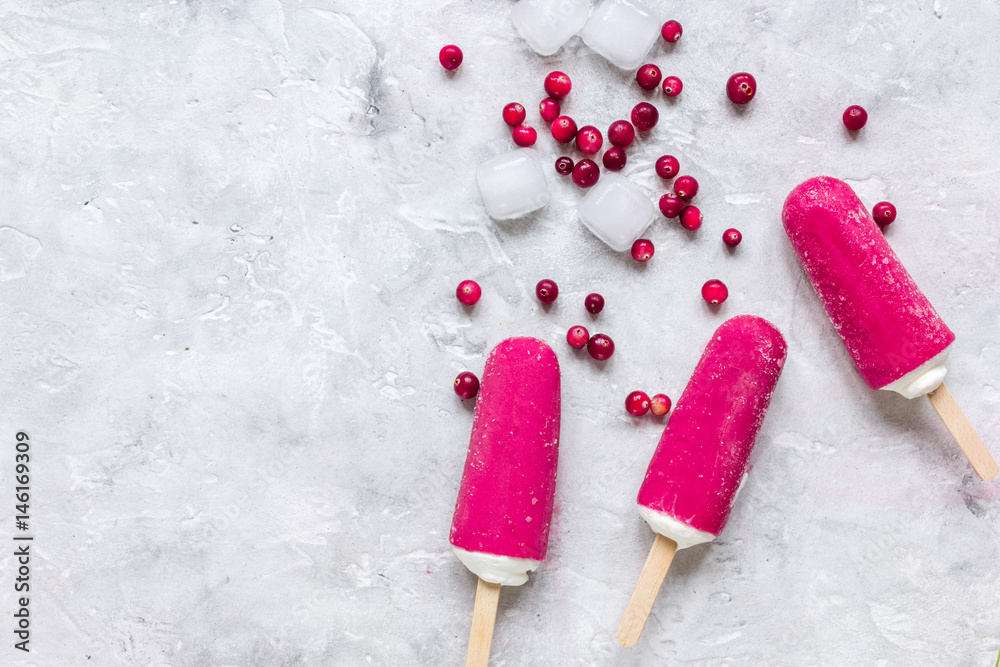 frozen cowberry and fruit ice-cream on gray table background top view mock-up