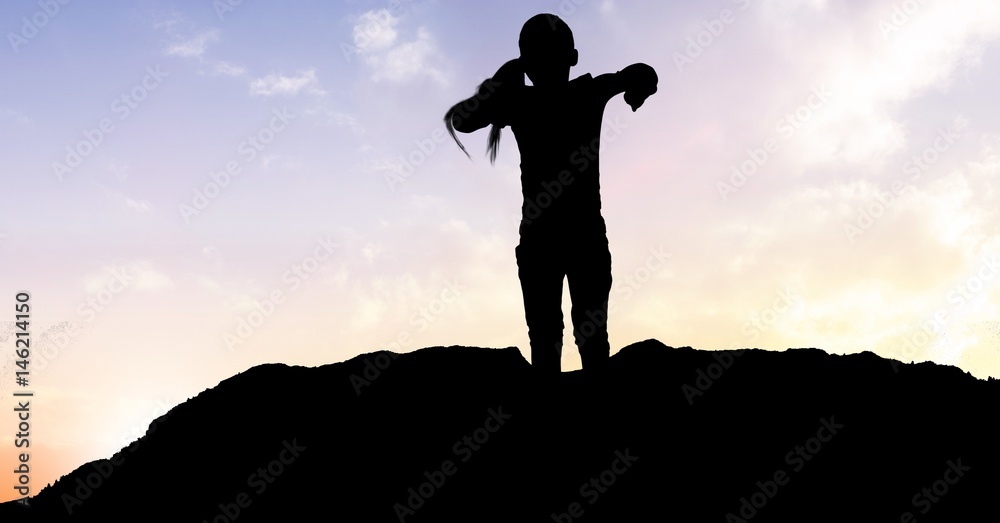 Silhouette girl standing on mountain against sky