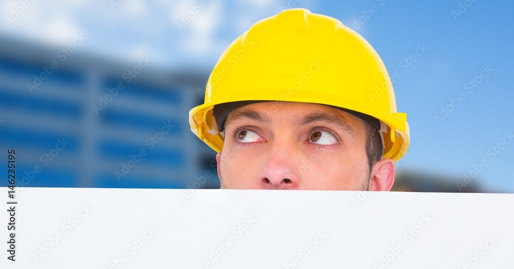 Worker with bill board looking away