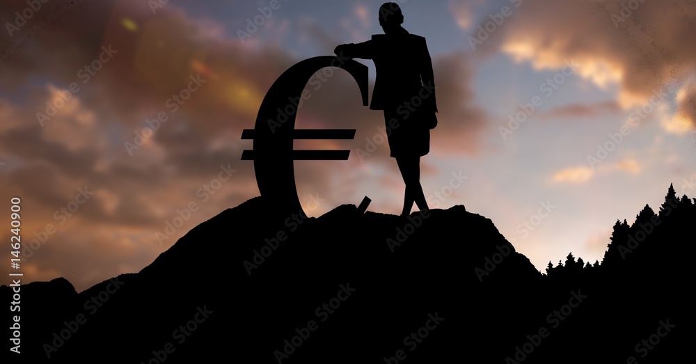 Silhouette businesswoman by euro sign on hill