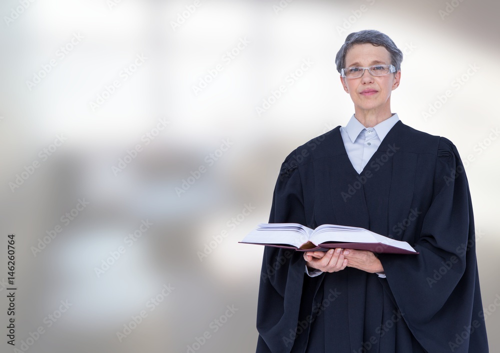 Judge holding book in front of office windows