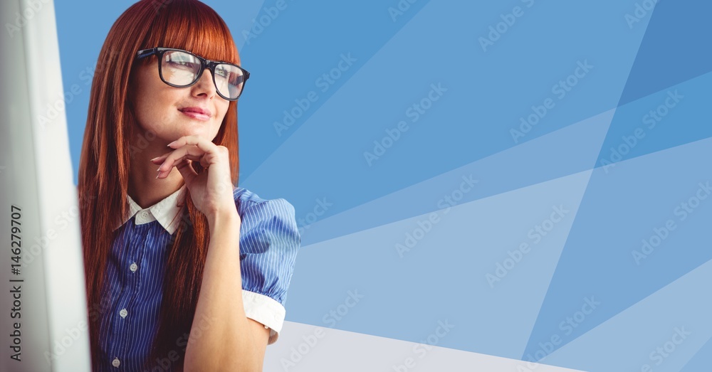 Woman at computer against blue vector mesh