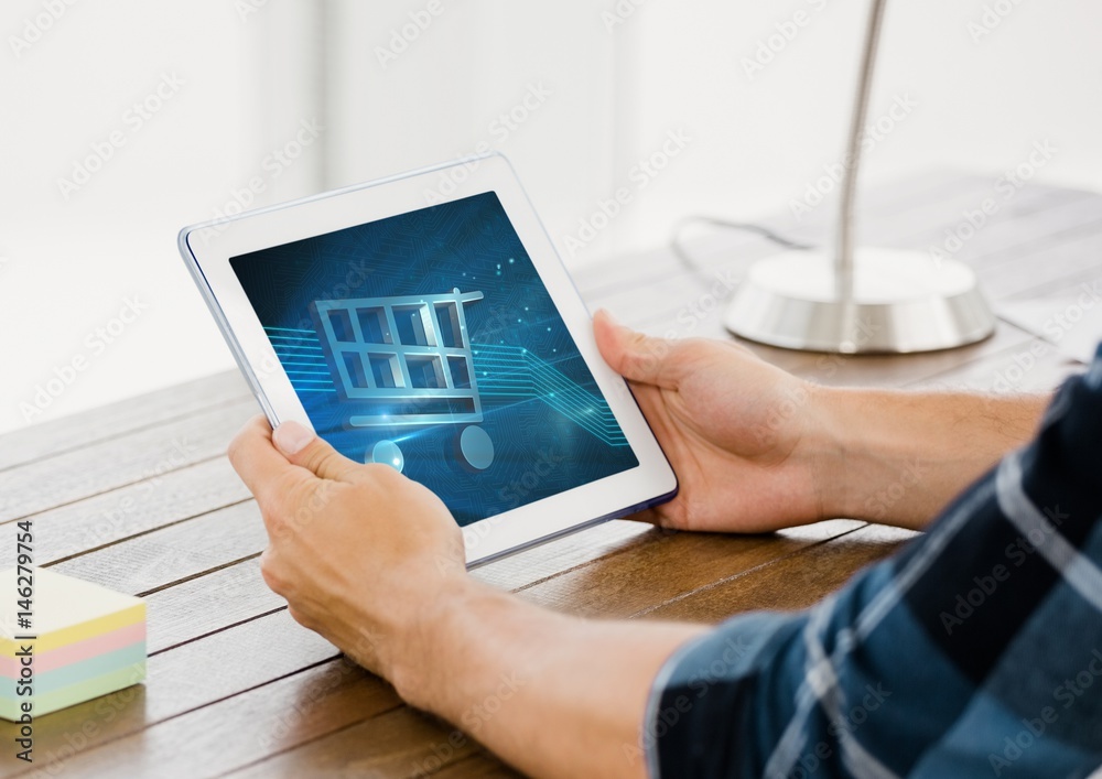 Person using Tablet with Shopping trolley icon