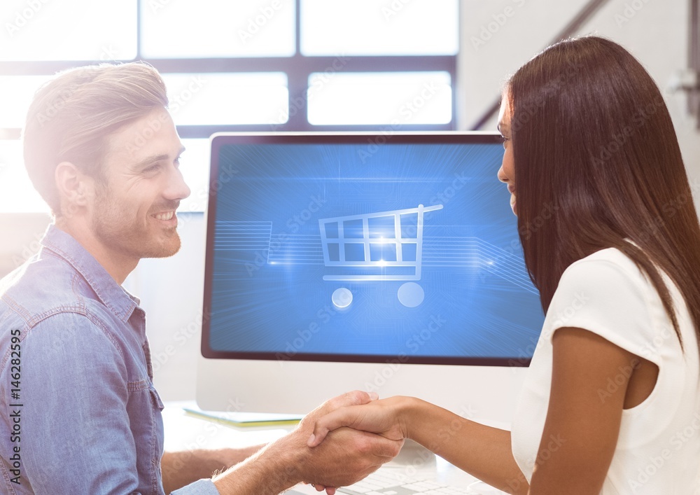 Two People using computer with Shopping trolley icon