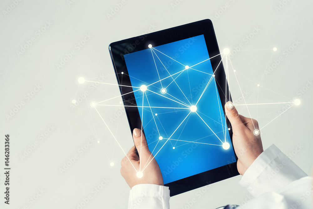 Close of female doctor hands working with tablet pc computer