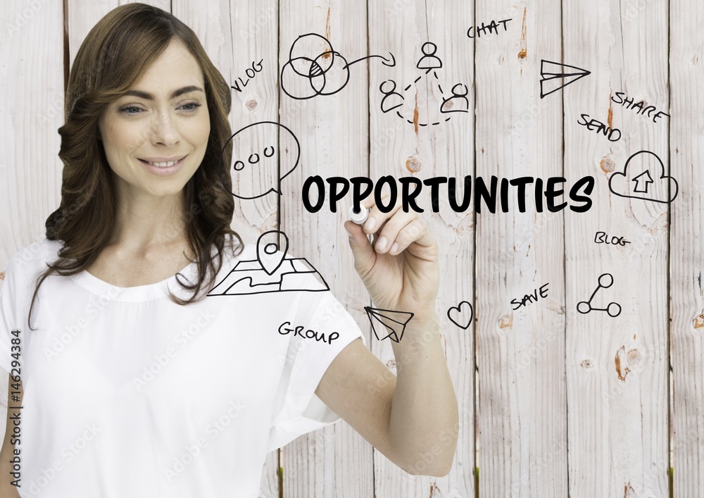 Opportunities graphic. Woman writing it. Wood background