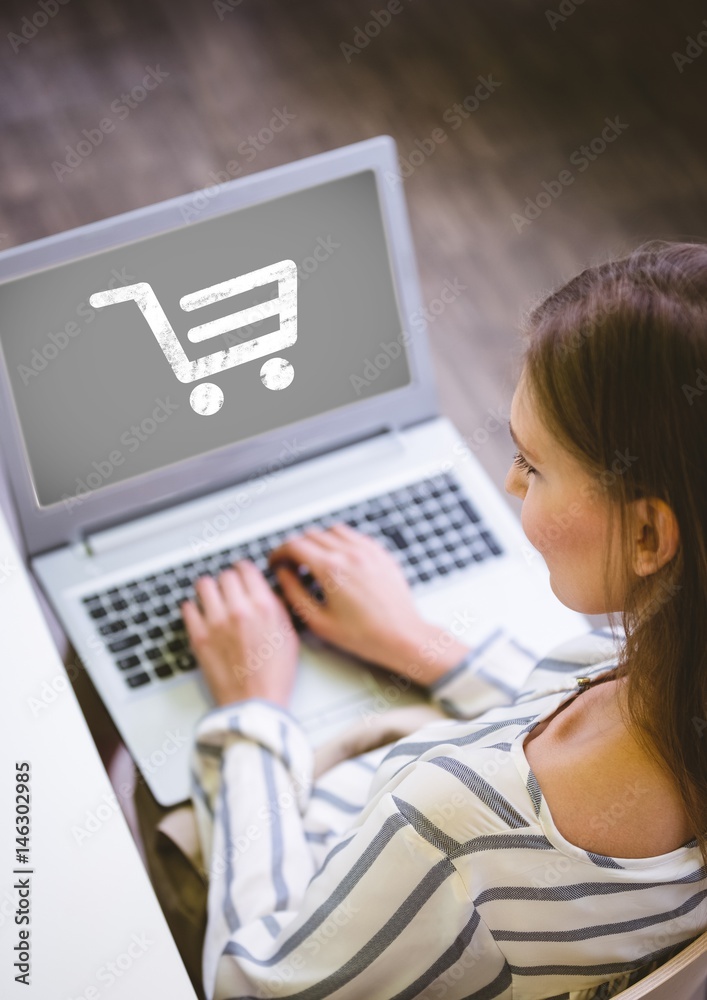 Woman using Laptop with Shopping trolley icon