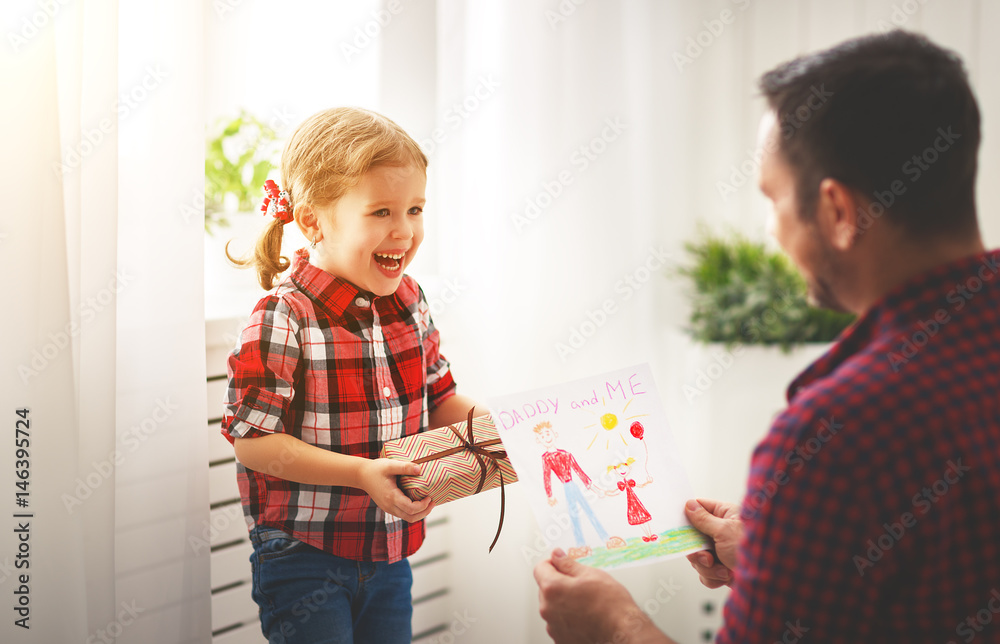 Fathers day. Happy family daughter giving dad greeting card