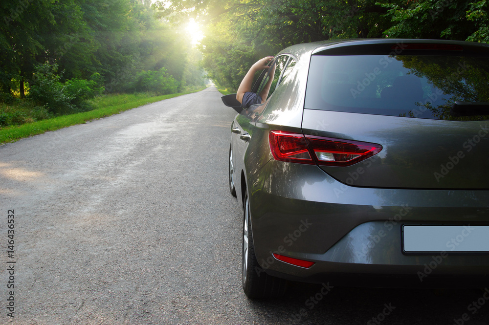 Car on asphalt road in nature