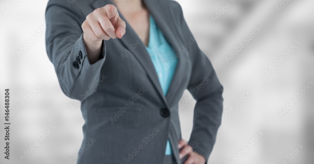 Midsection of businesswoman pointing