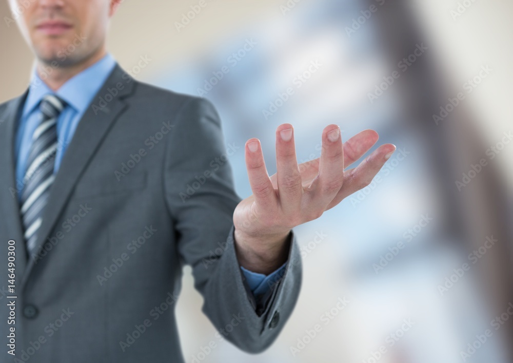 Midsection of businessman gesturing