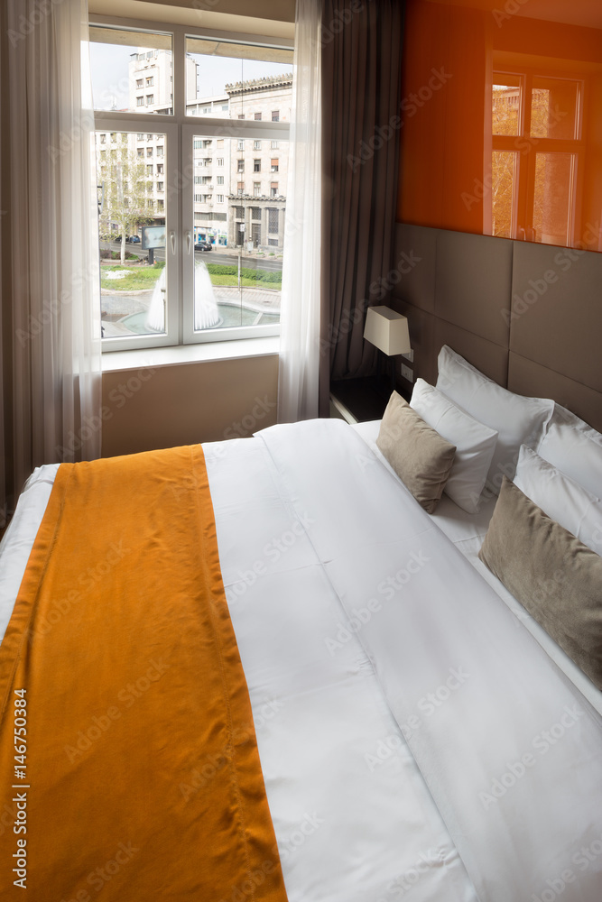 Interior of a hotel bedroom with bathroom