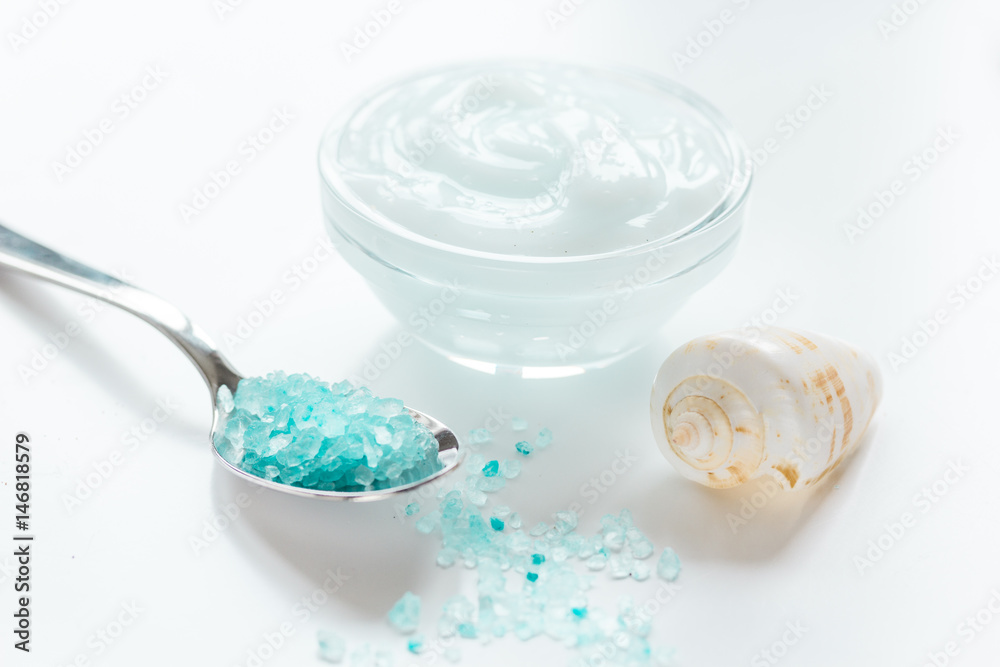 set for bath with salt and shells on white table background