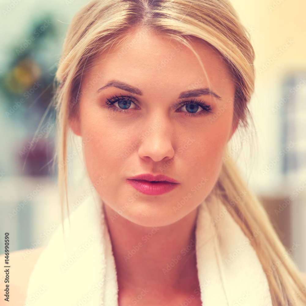 Young fit healthy woman with towel