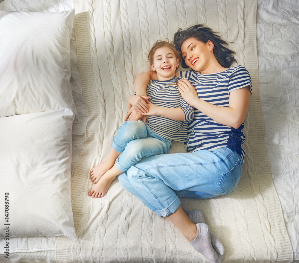 Mom and her daughter are playing