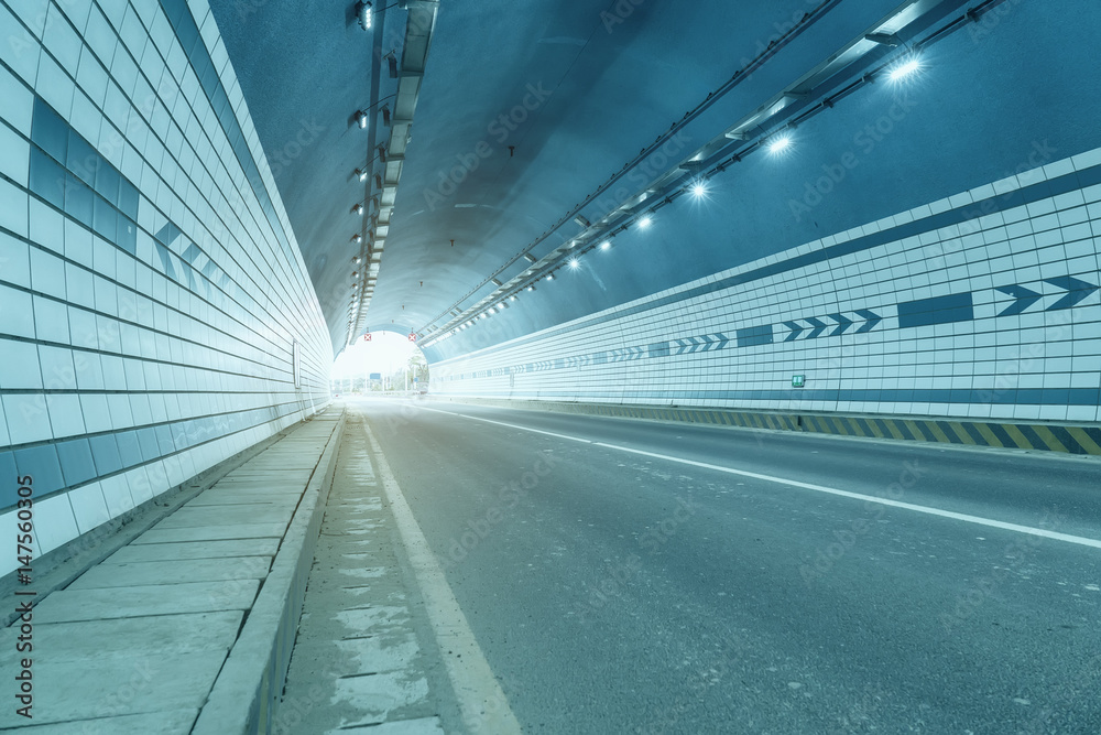 Abstract speed motion in urban highway road tunnel, blurred motion.