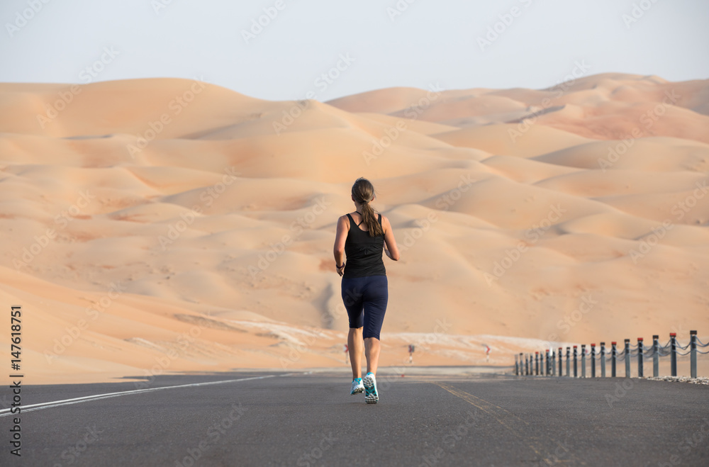 Woman exercising in the desert.