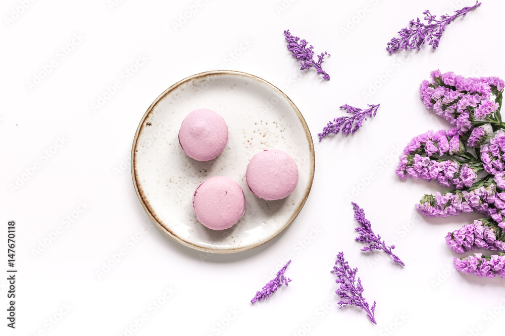 spring woman breakfast with macaroons and flowerstop view space for text